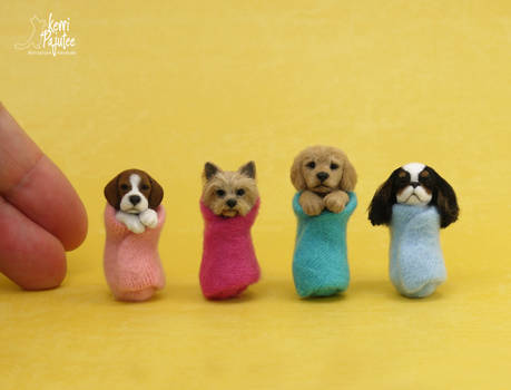 Miniature wrapped puppy sculptures