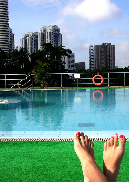 LAYING BY THE POOL SIDE.