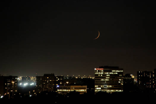 New Moon Backlit by the Passed Sunset