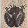 Spider-Girl hanging on the brickwall