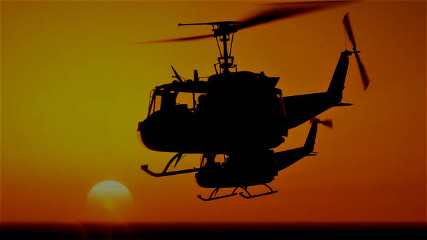 Hueys flying in the sunset