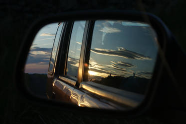 Sunset in wing mirror