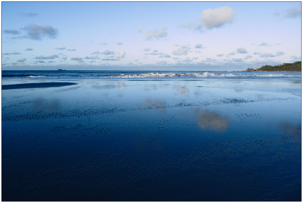 Clouds on wet sand