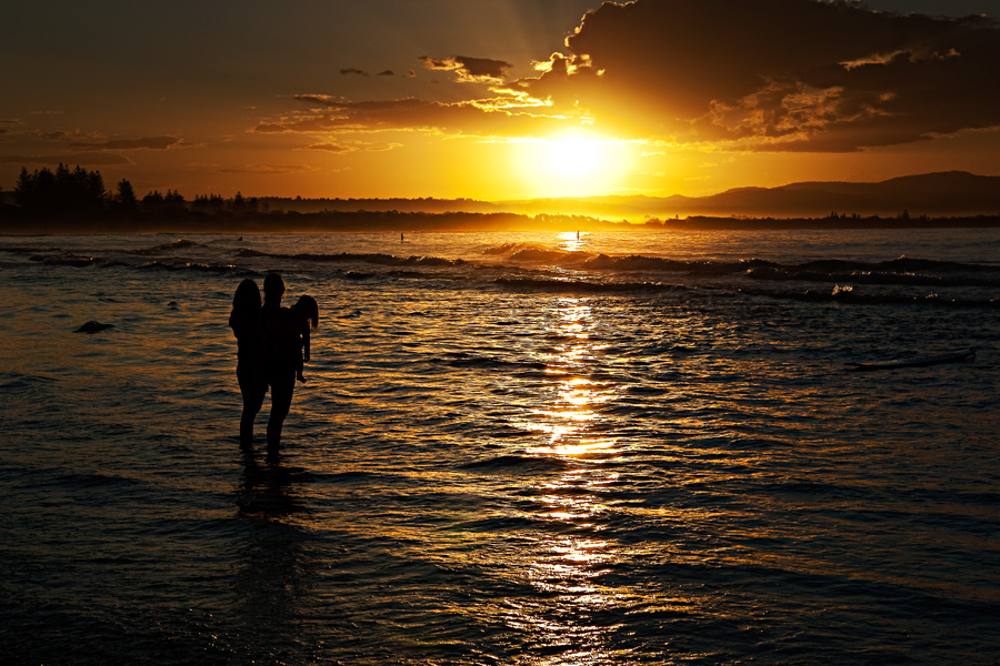 Three heads at sunset