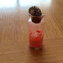 Mini bottle of sand and seashells :3