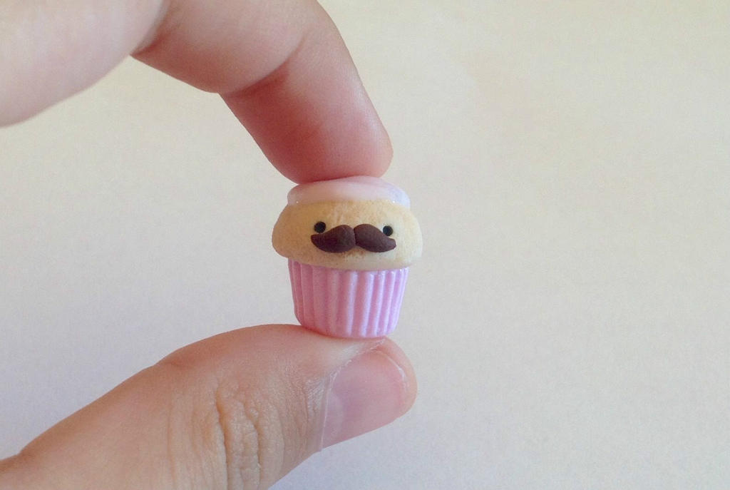 Adorable pink cupcake with a moustache