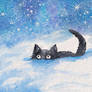 Little funny black cat playing with snow