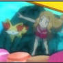 Serena swimming underwater with Fennekin 