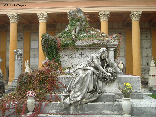 Sad girl on a tombstone