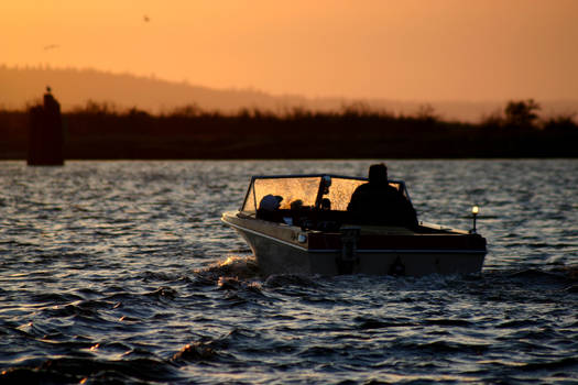 motorboat at sunset