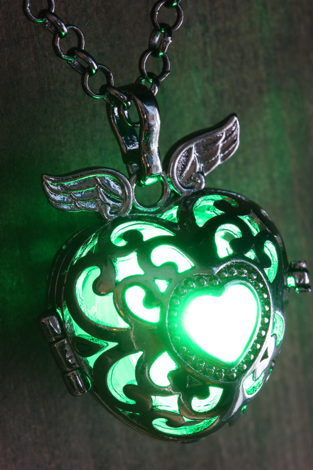Green Glowing Black Winged Heart Pendant