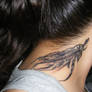 Feather tattoo on neck