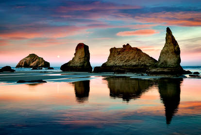 LOW TIDE AT BANDON BEACH WITH FULL MOON SET OREGON