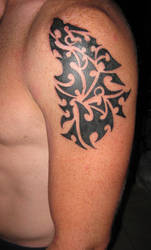 Tribal wolf tat on skin