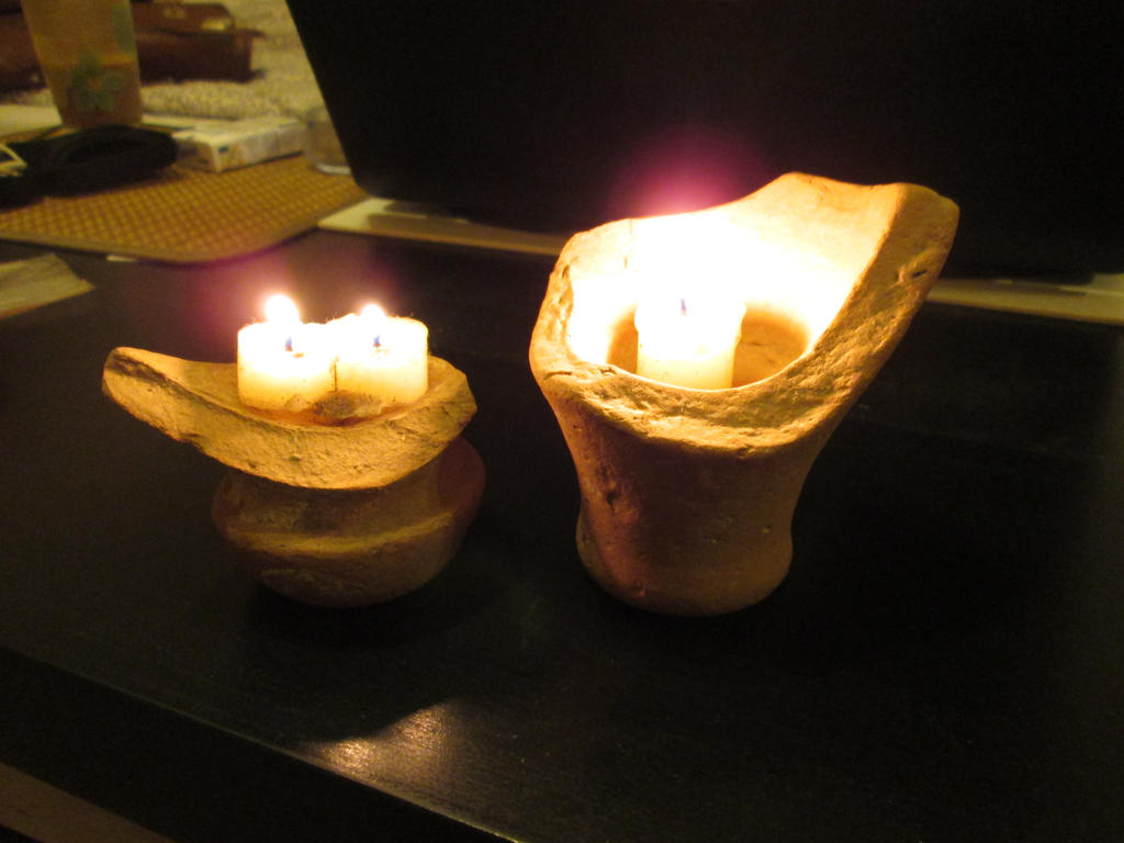 The candlesticks made of antique amphoras.