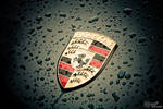 Porshe badge under the rain... by S6T9N