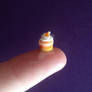 Miniature candy corn cupcake.