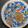 Medieval snail-cat illumination embroidery