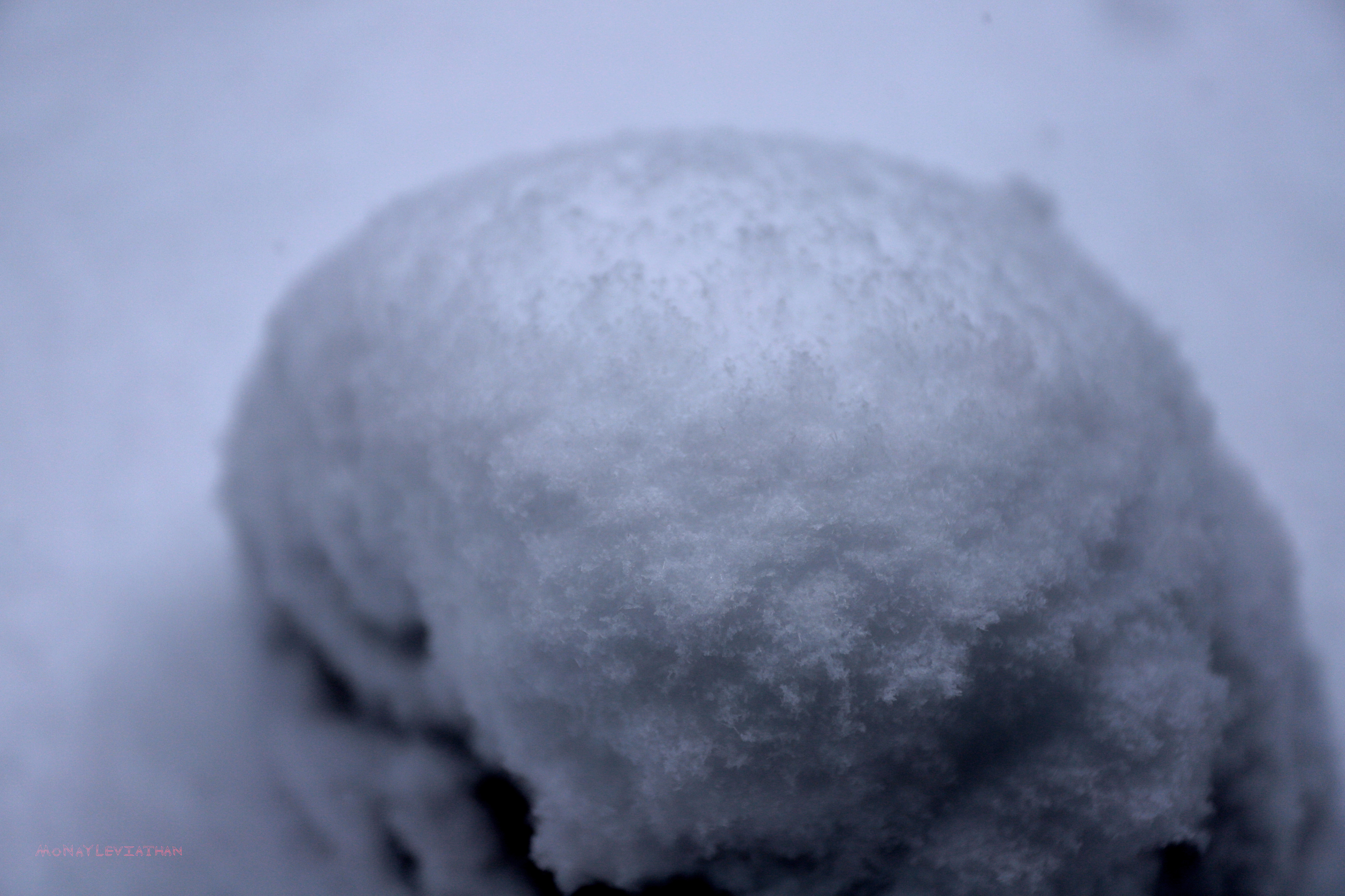 Crisp Cold White Fluffy Snow Pile On Rock