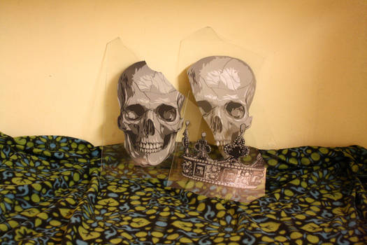 Skulls and crown on glass