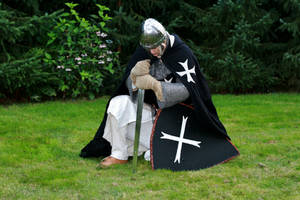 Hospitaller praying