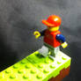 Lego man walking on Minecraft blocks
