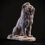 Lion sitting on a stone