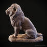 Lion sitting on a stone