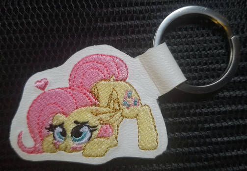 Playful Fluttershy keychain tag