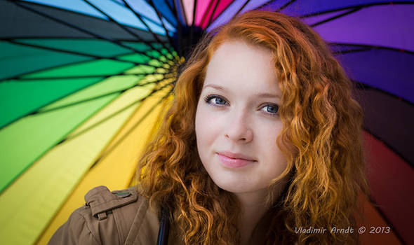 Redhead girl and rainbow