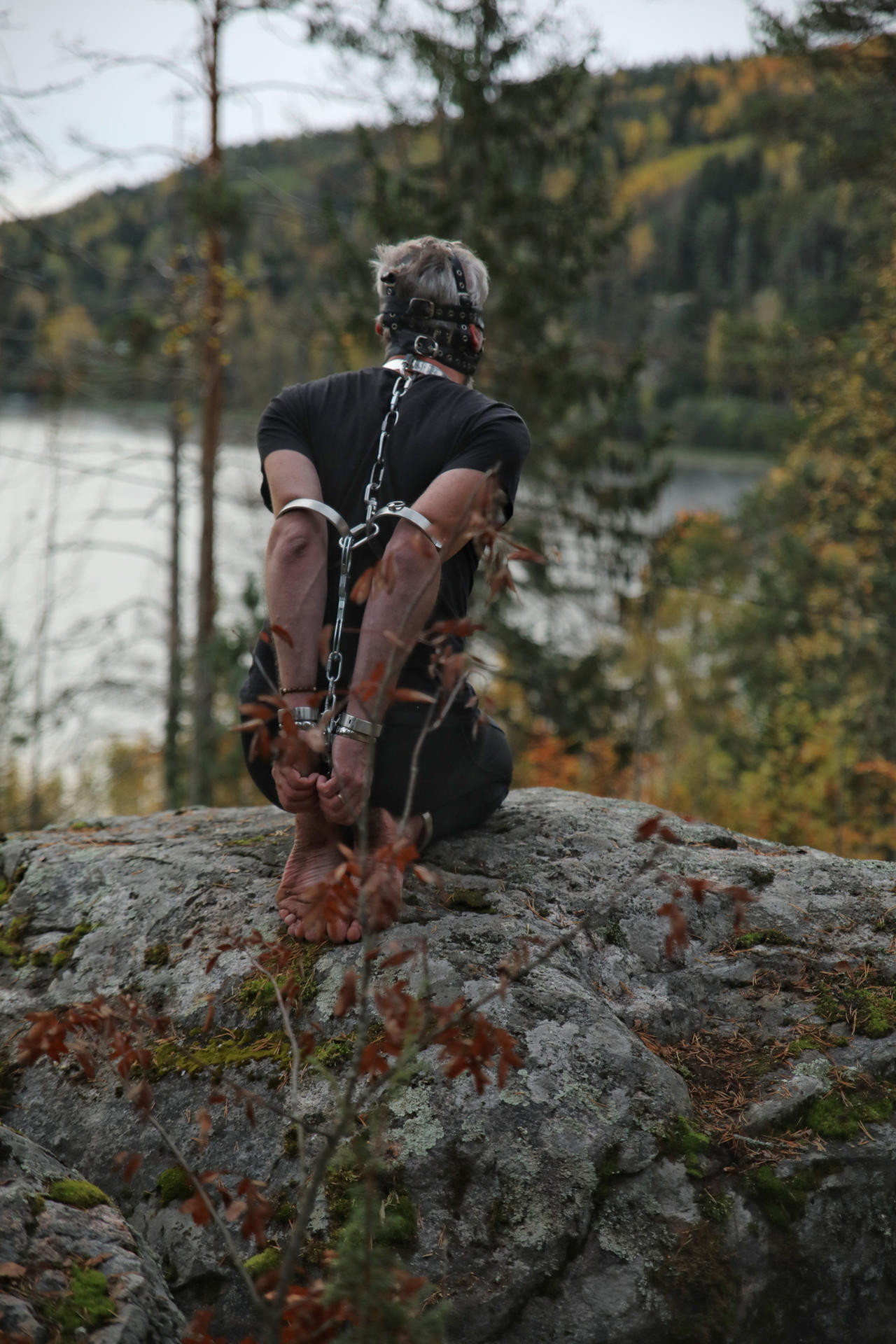 Outdoor in steel restraints 5 by TrueTiedTales on DeviantArt