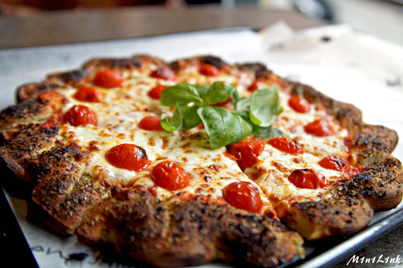 Pizza with tomatoes and basil