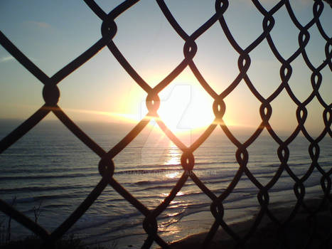 Sunset Through Fence