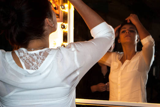 Girl doing her hair the photoshoot