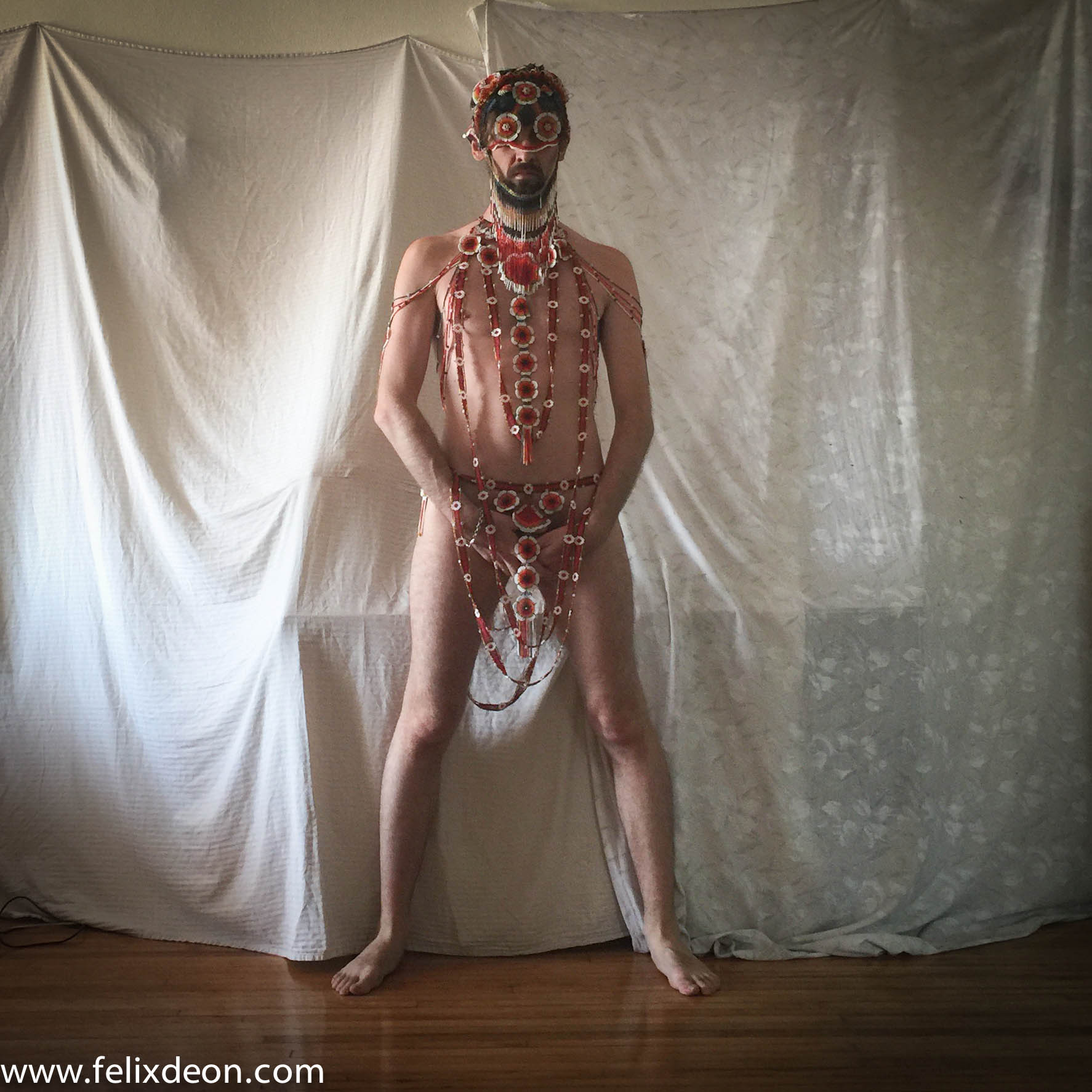 Male nude in a beaded costume 3