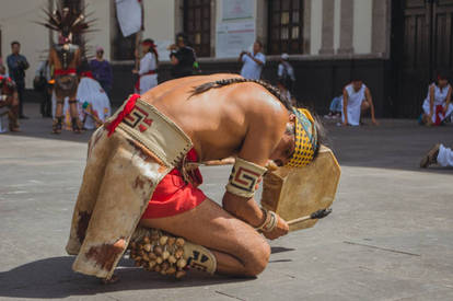 aztec dancer playing drum