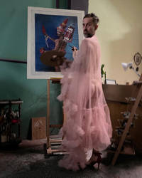 artist in a pink robe