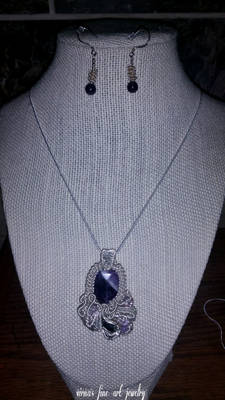 Sterling silver wire and amethyst stone