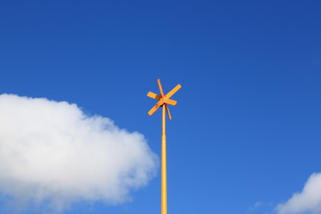Yellow cross on pole by zertrin