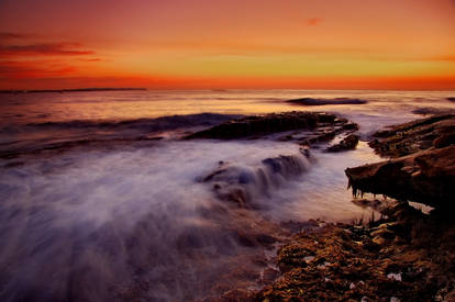 Flowing under an orange sky