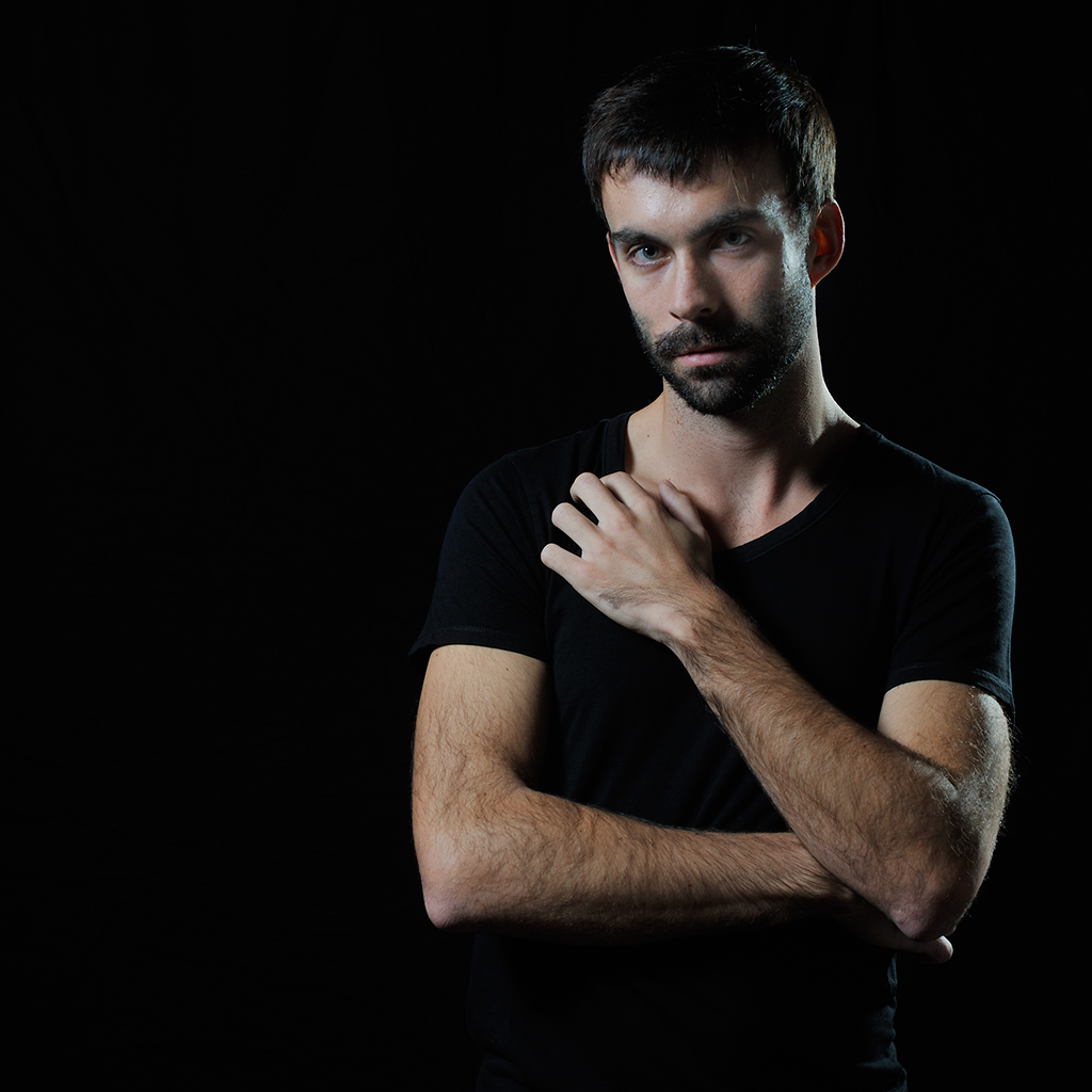 Portrait of a young man with a black t-shirt