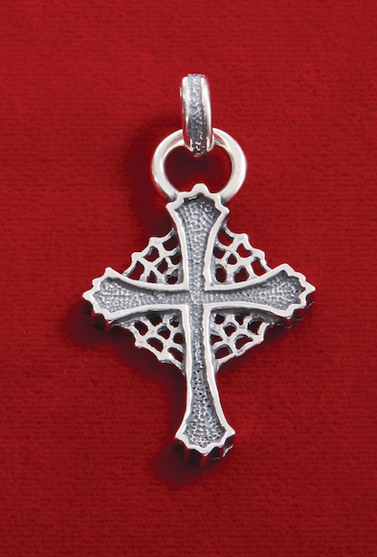 Large web cross pendant.