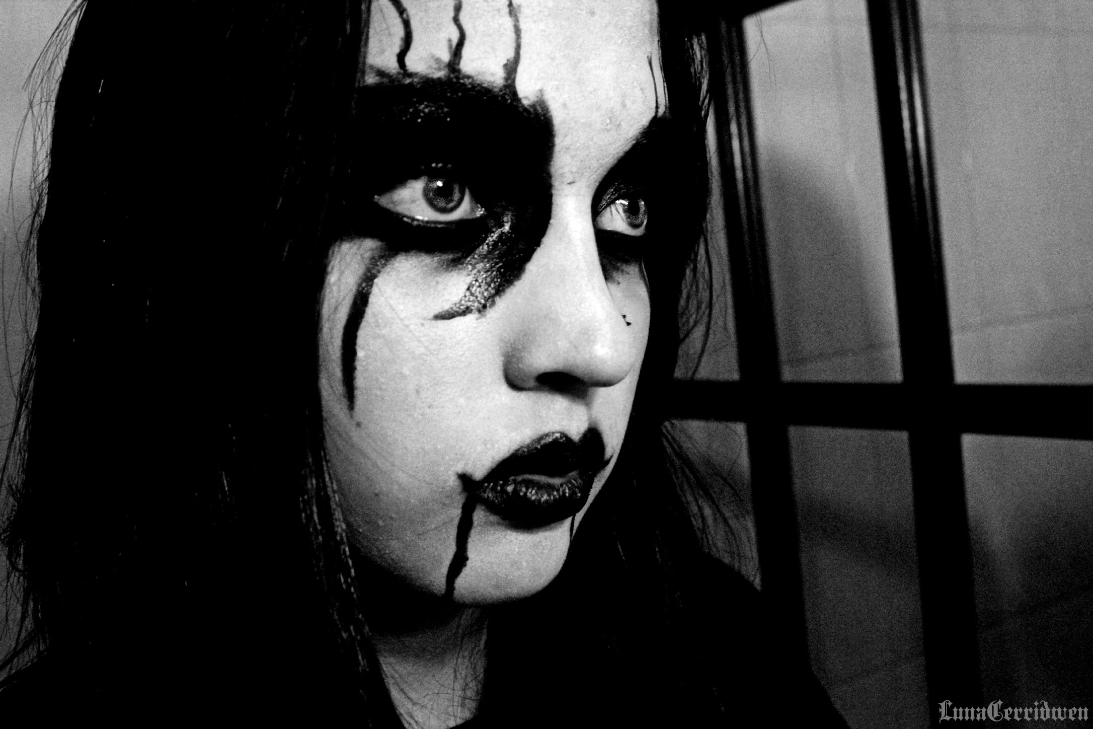 Portrait of a woman with black metal corpse paint in the art style