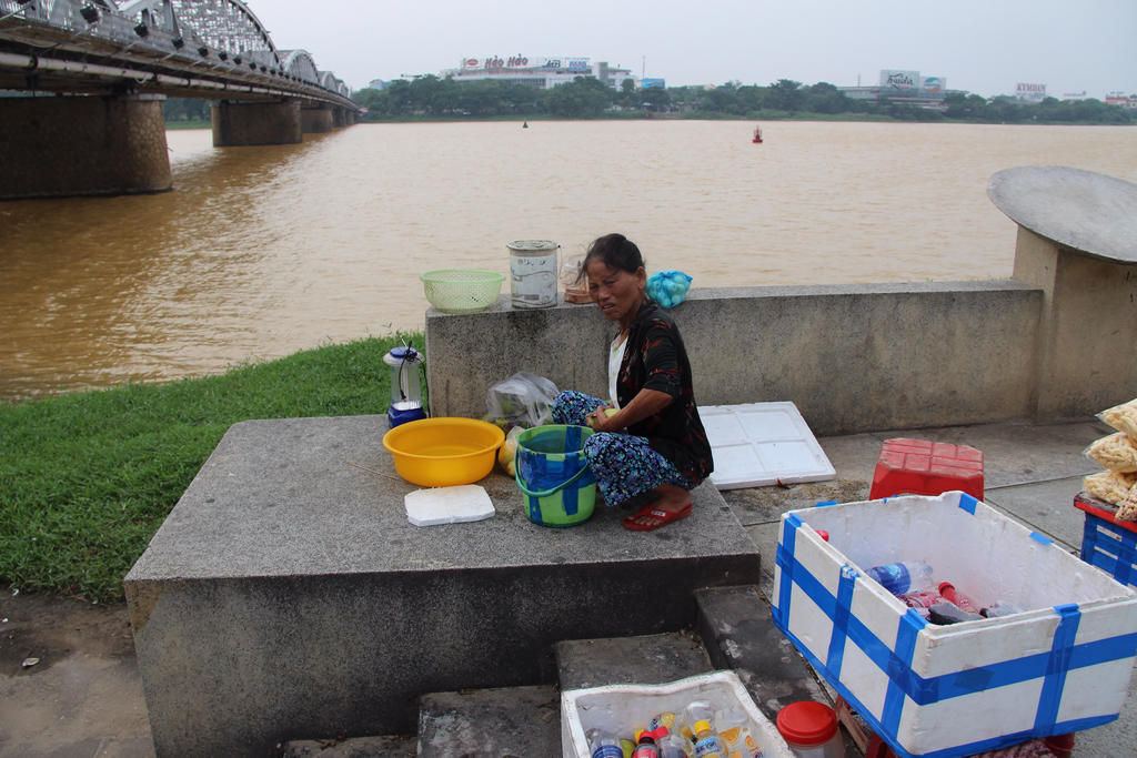 Squating old female Vietnam