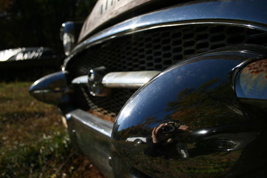 reflection off old buick.