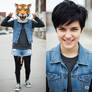 girl wearing a tiger mascot head
