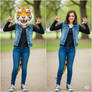 girl wearing a tiger mascot head
