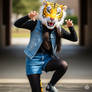 girl wearing a tiger mascot head