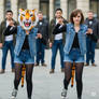 girl wearing a tiger mascot head