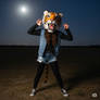 girl wears a tiger mascot head